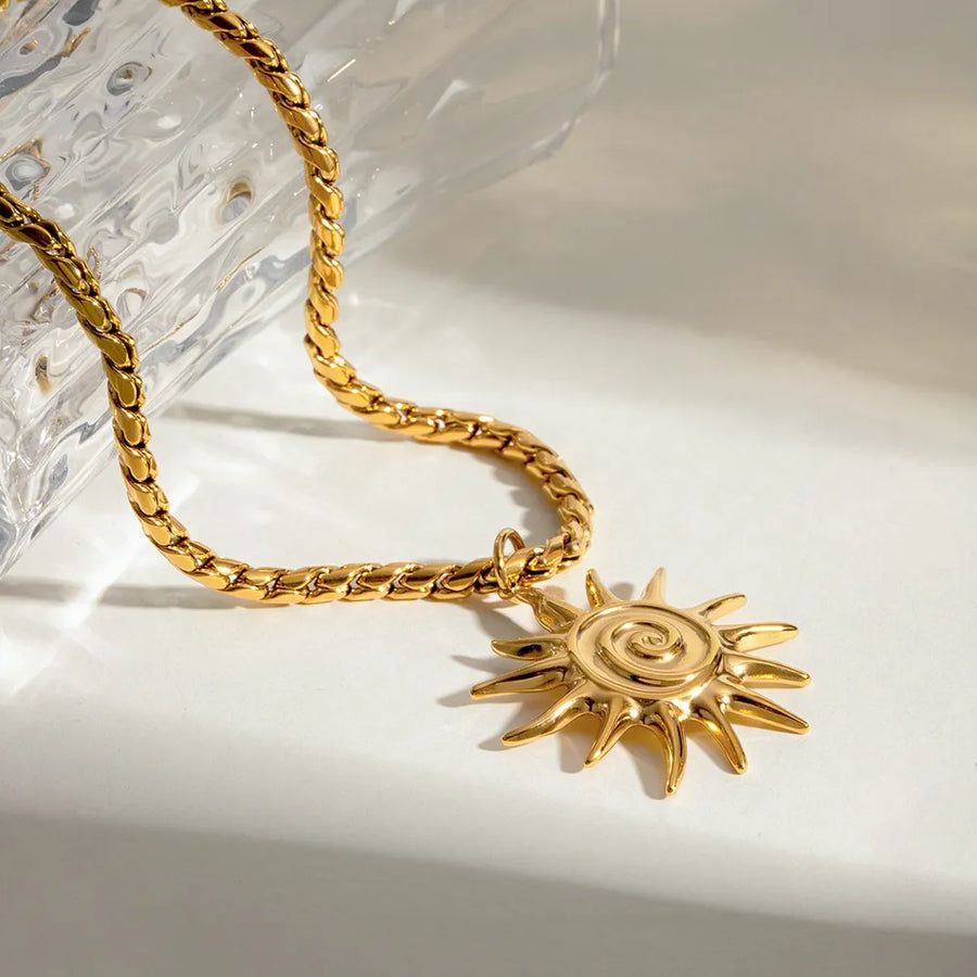 Gold necklace featuring adjustable chain and sunburst