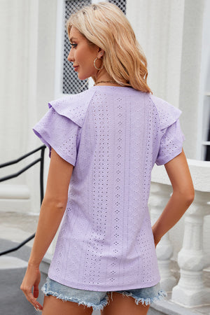 Lavender eyelet blouse with flutter sleeves and a detailed pattern.