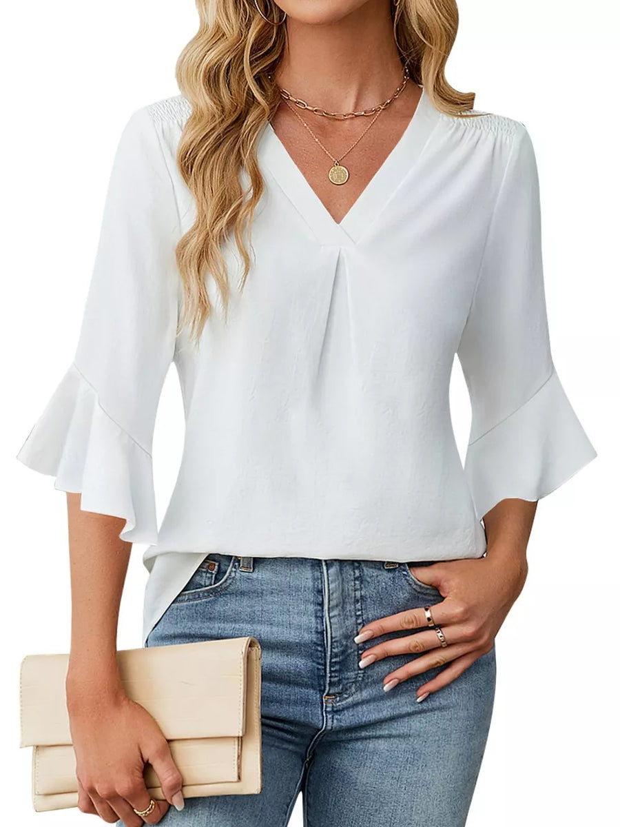 White V-neck blouse with ruffle sleeves and subtle pleating.