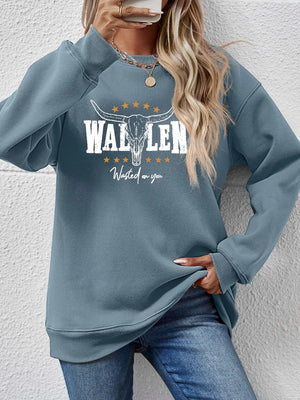 Misty Blue graphic sweatshirt with bull skull and text detail, drop shoulder, crew neck, casual fit.