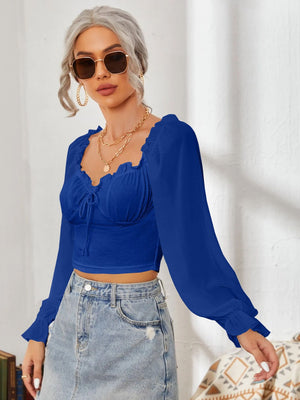 Royal blue bustier sleeve blouse with sweetheart neckline and tie detail