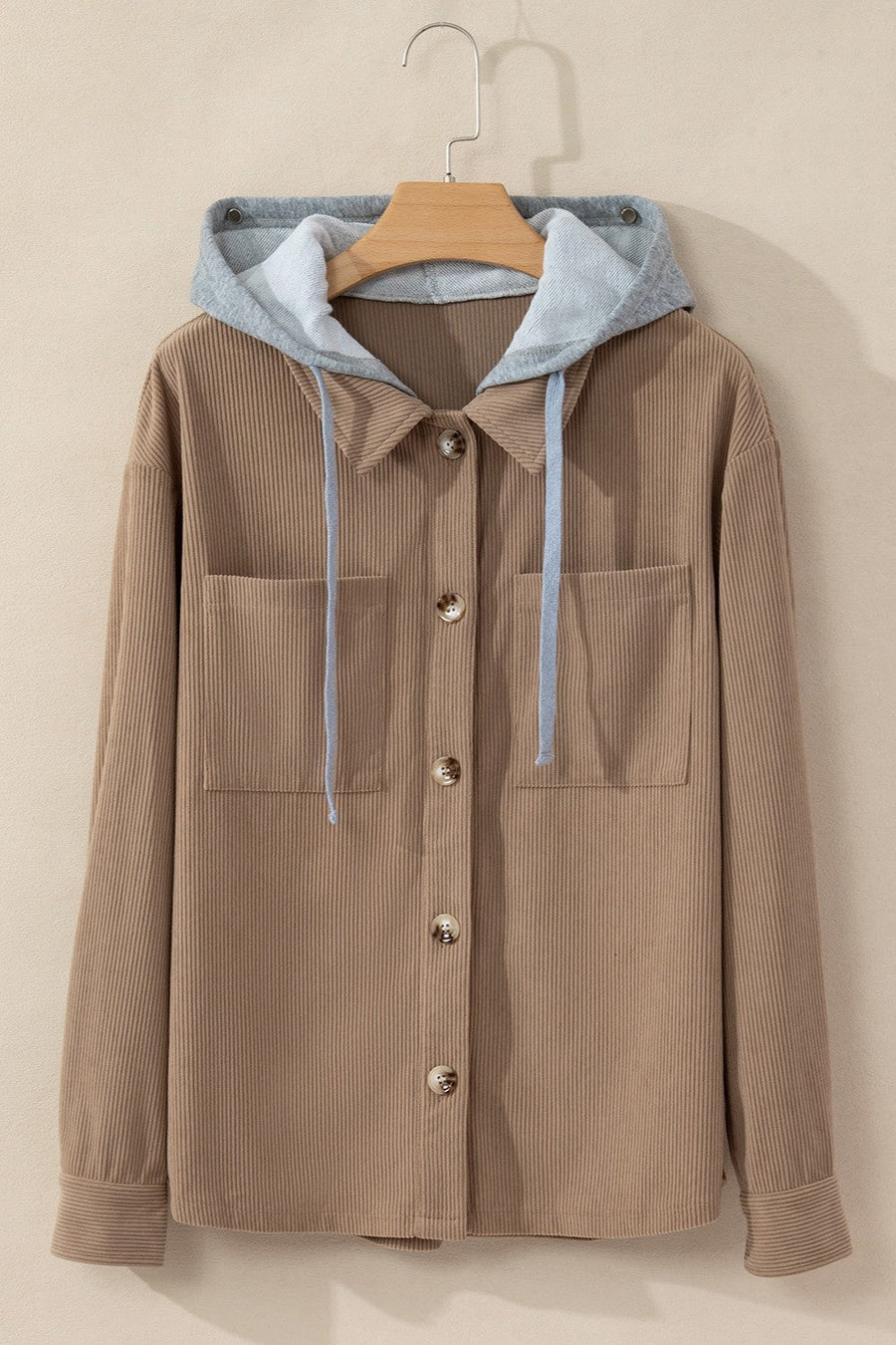 Mocha corduroy shirt jacket with contrast gray hood and button front.
