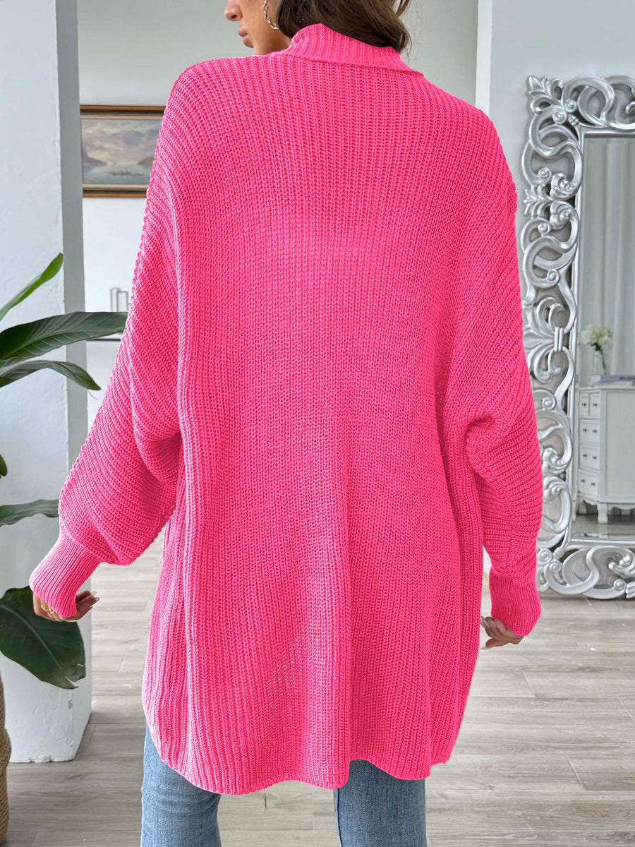 Ribbed knit cocoon cardigan in bright pink with a relaxed fit and balloon sleeves.