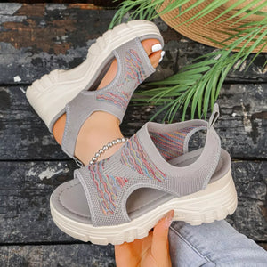 Gray open-toe platform sandals with colorful geometric knit pattern and chunky sole.