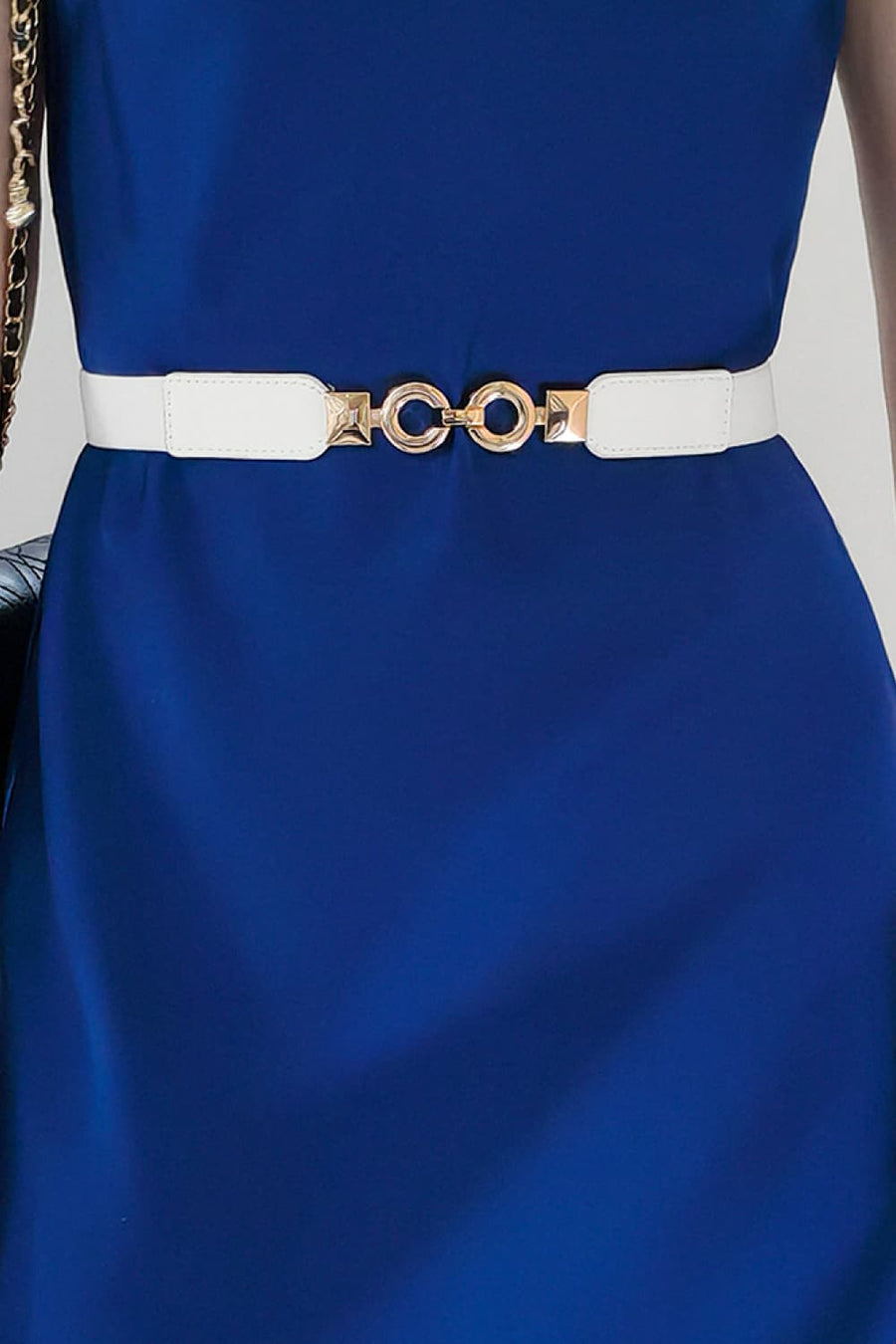 White elastic belt with gold interlocking circle buckle detail