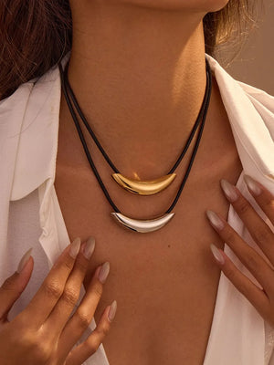 necklace in black featuring layered and slim fit