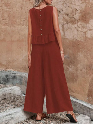 Burgundy ruffled peplum top with button back and wide-leg pants set.