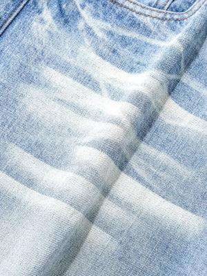 Light blue relaxed fit denim capris with a distressed wash and cotton fabric.