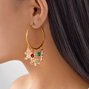 Gold earrings featuring charms and christmas-themed charms