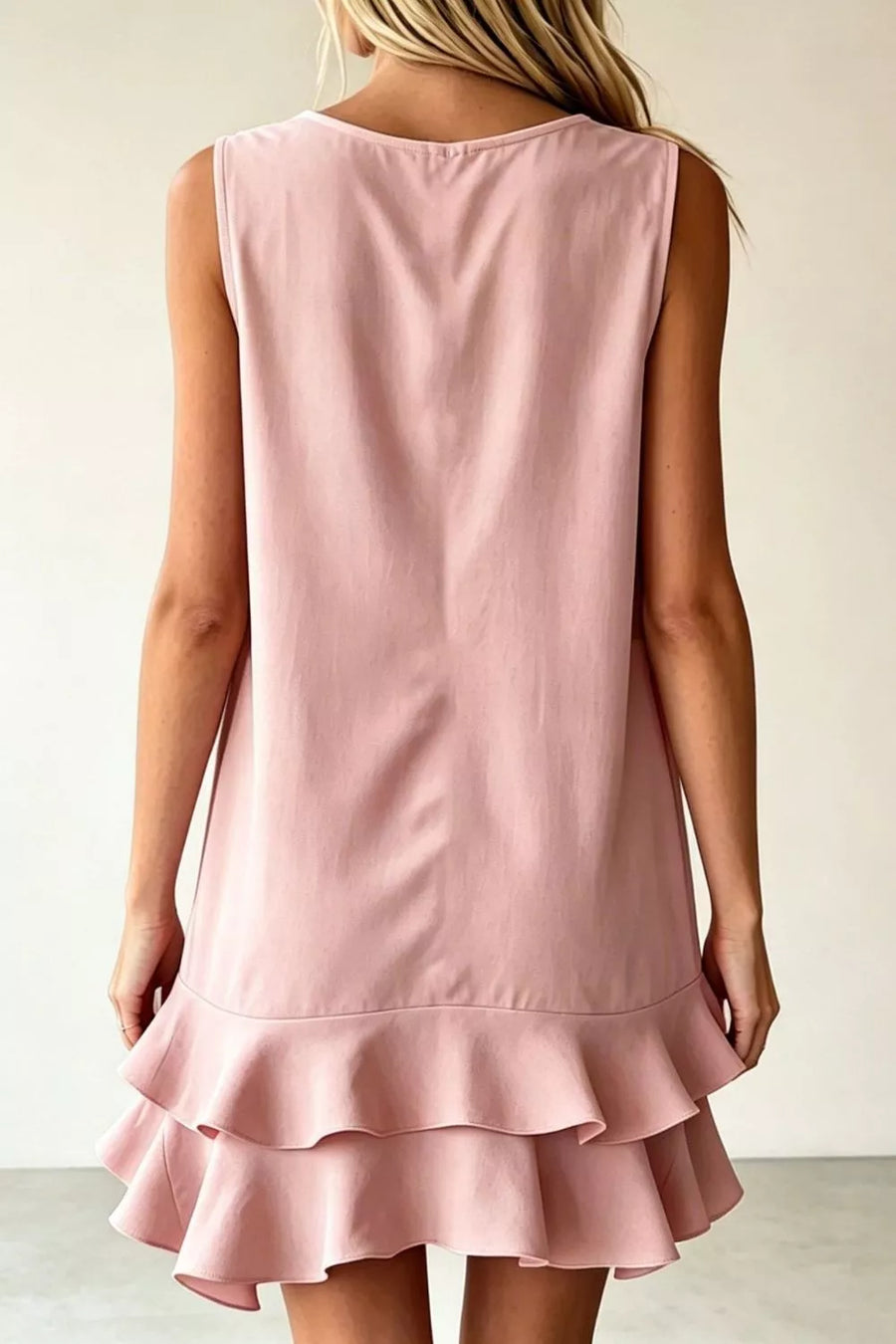 Dusty pink sleeveless mini dress with tiered ruffle hem