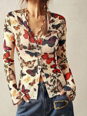 cream button-down shirt with butterfly print and v-neck