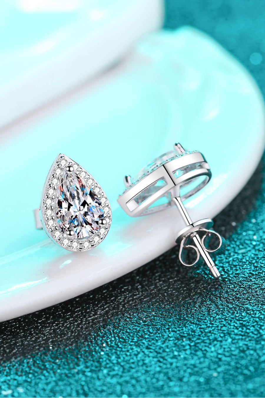 Silver teardrop halo stud earrings with clear pavé crystals.