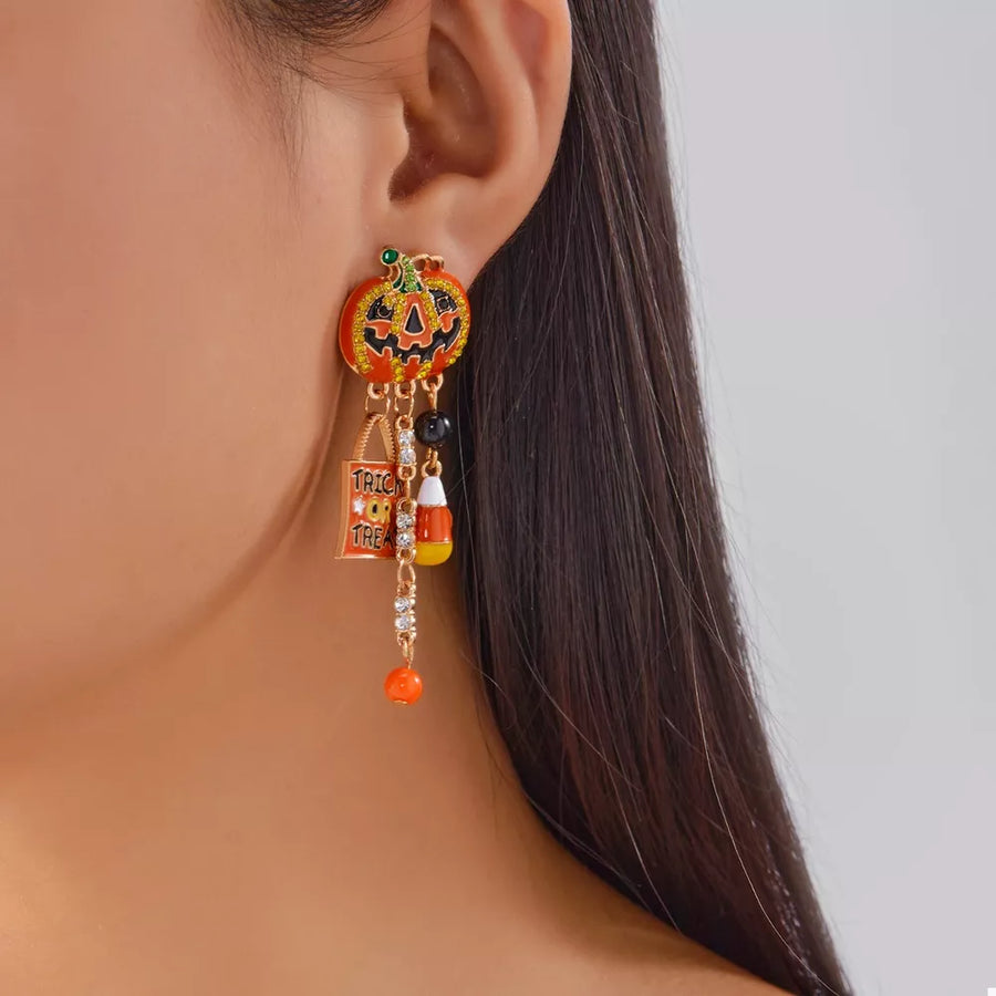 black earrings featuring rhinestone embellishment and novelty print