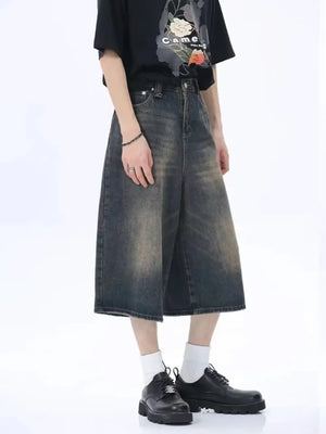 Dark wash denim culotte shorts with a vintage fade and wide leg.