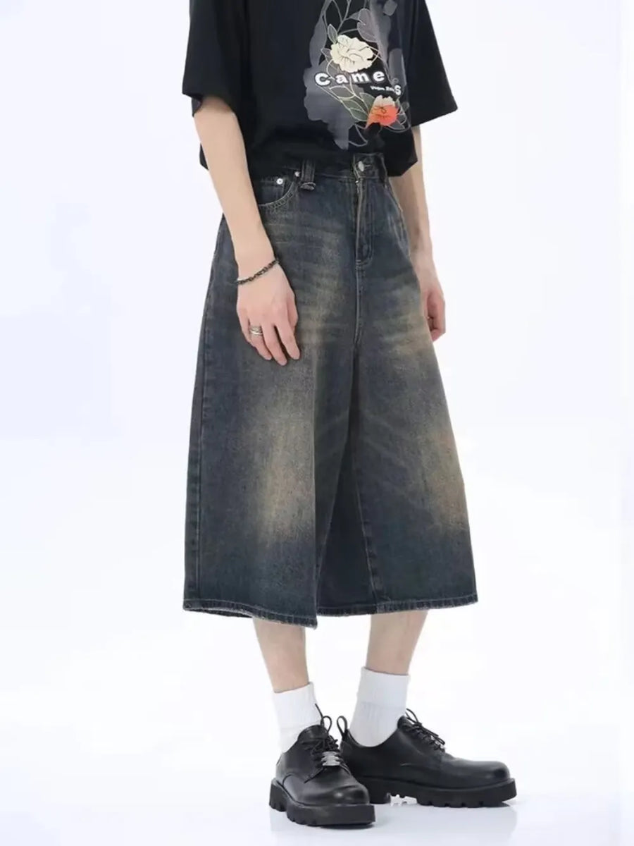 Dark wash denim culotte shorts with a vintage fade and wide leg.