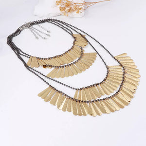 necklace in gold with layered and long