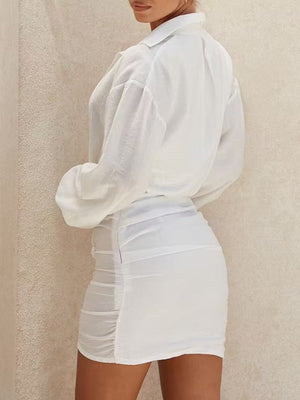 White relaxed mini dress with deep v-neck
