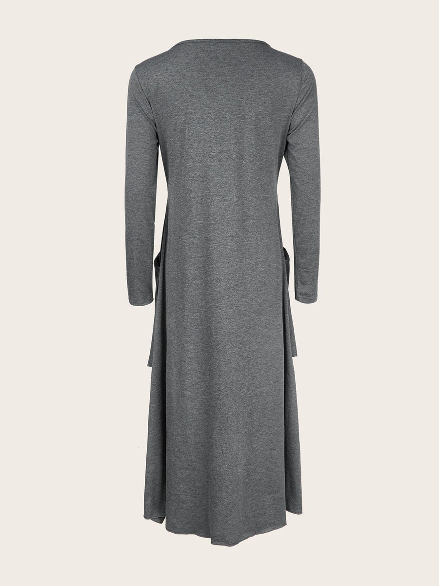 Dark gray midi dress with long sleeves, asymmetrical tiered hem, and pockets.
