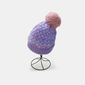 Lavender ombre knit beanie with textured weave and pink pom pom.