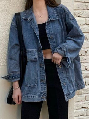 denim jacket in medium wash blue featuring washed and oversized fit