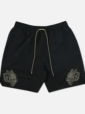 Black performance shorts with embroidered wolf heads and a drawstring waist.