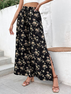 Black floral palazzo trousers with a split hem