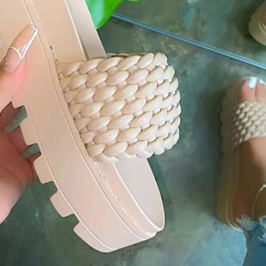 Cream woven platform slide sandals with thick lug sole.