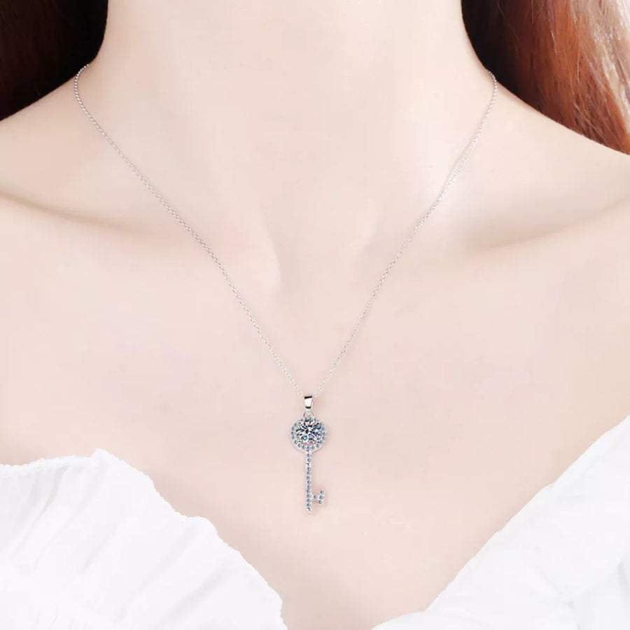 925 sterling silver,Moissanite Carat weight: 1ct Care instructions: Avoid wearin necklace in clear with key shape silhouette