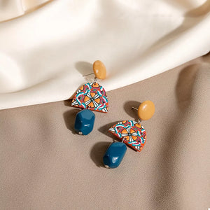 earrings in orange featuring drop design and drop fit