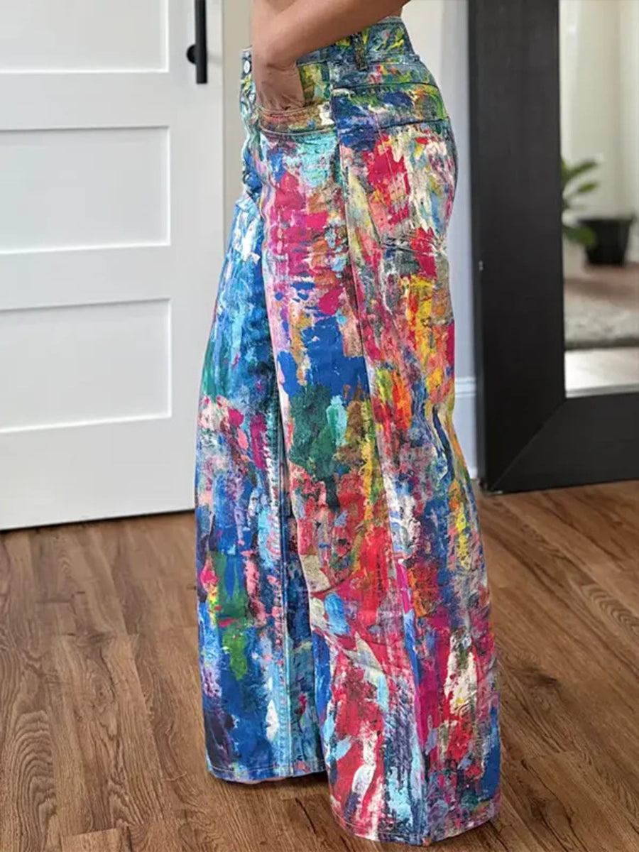 Abstract print wide-leg jeans in a cotton blend, featuring a colorful paint-splatter design.