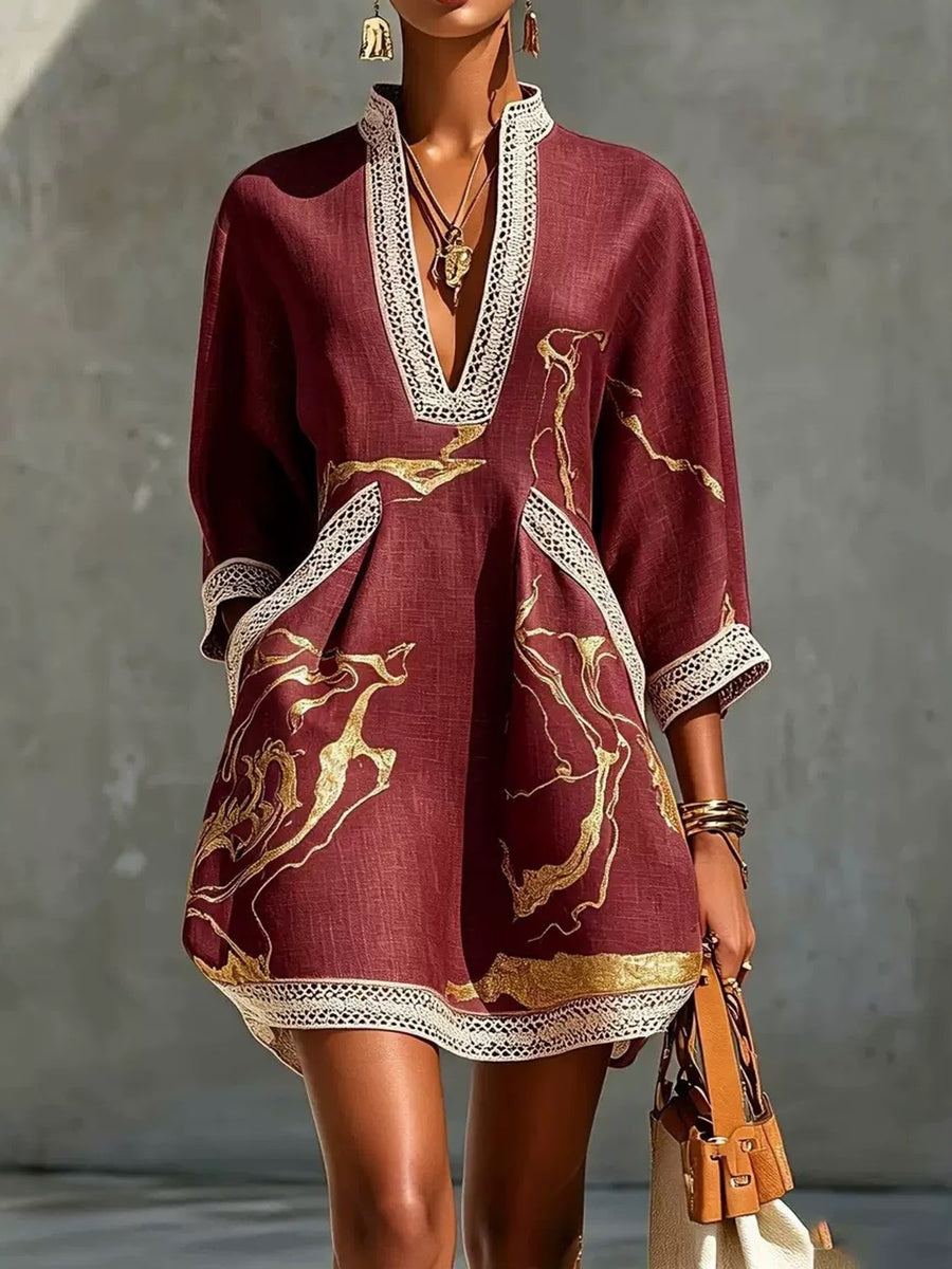Burgundy mini dress featuring lace detail and abstract-print