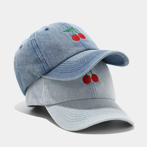 Denim Imported Size & cap in light wash denim with structured silhouette