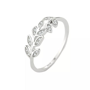 Delicate sterling silver ring with a leaf design accented with small crystals.