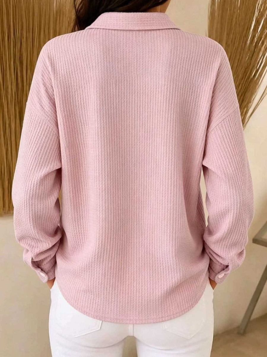 Pink blouse featuring collared and waffle knit