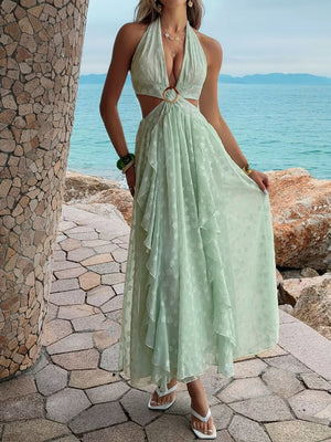 Light green textured ruffled halter neck maxi dress with cutouts and a wood ring detail.