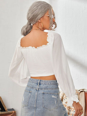 White square neck bustier blouse with ruffled trim and long sheer sleeves