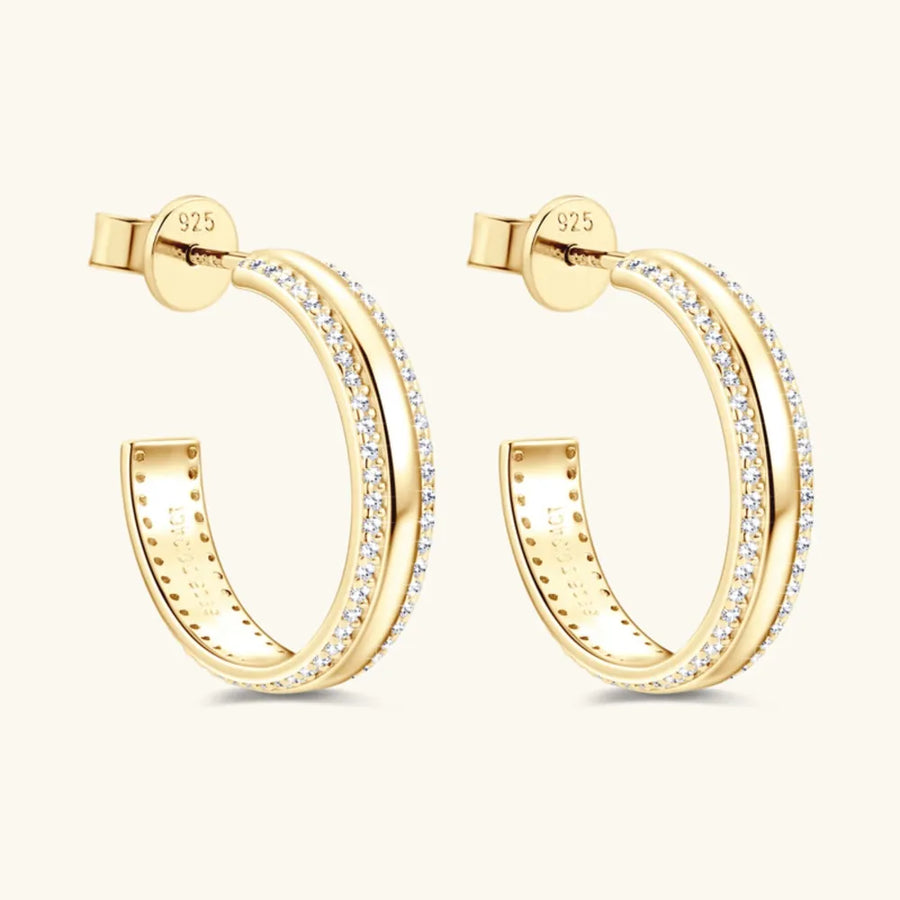 Gold pavé moissanite C-hoop earrings in sterling silver with diamond accents.
