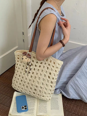 brown handbag featuring woven construction and geometric