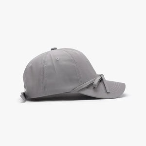 Gray baseball cap with tied-back detail and breathable fabric.