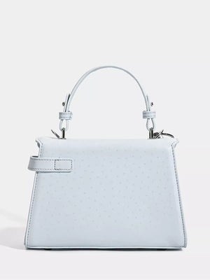 Chic mini pu leather tote in blue with buckle detail and subtle embossed pattern.