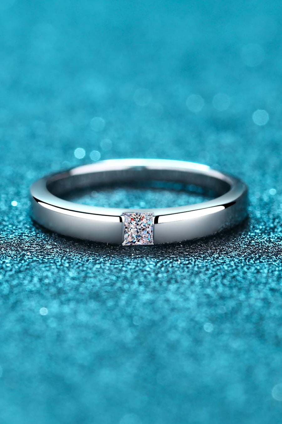 Silver band ring with a square-cut solitaire diamond accent