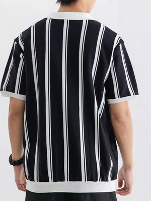 Black and white striped cotton polo shirt with white collar and cuffs.