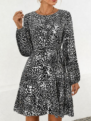 white mini dress featuring tied and leopard-print