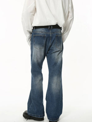 Faded flare jeans in dark wash denim with sculpted seam detail.