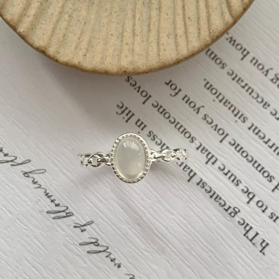 silver ring with n/a and open