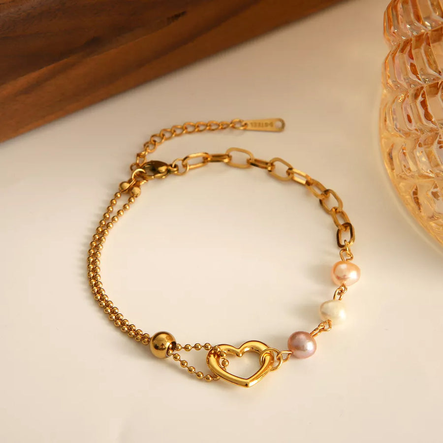 Freshwater Pearl, 18K Gold-Plated, Stainless Steel Care instructions: Avoid wear bracelet in cream with layered silhouette