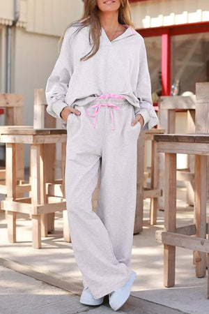 sweatshirt and sweatpants set in light gray featuring drawstring and relaxed fit