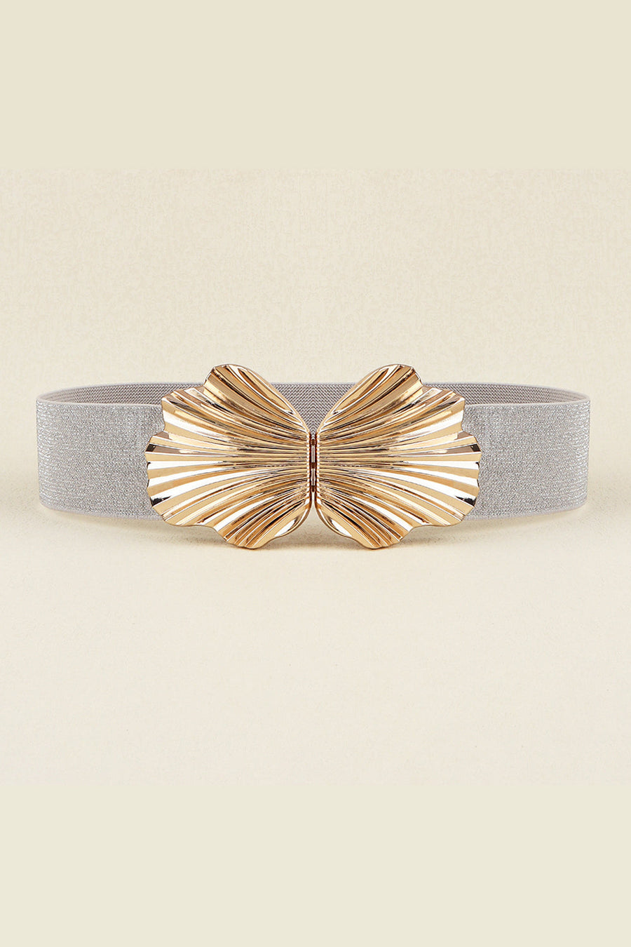 Silver elastic belt with a sculpted gold butterfly buckle.