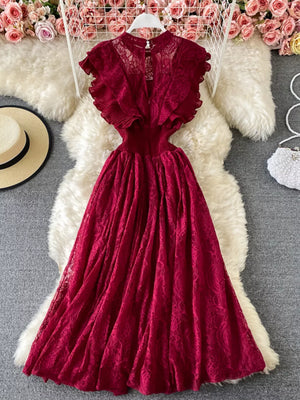 Red lace maxi dress with ruffled short sleeves and cutout detail.