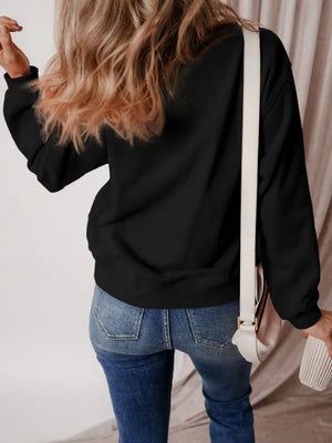 Black crewneck sweatshirt with long sleeves, casual basic style.